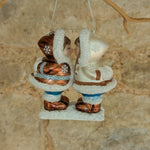 Load image into Gallery viewer, Inuit Kissing and Sledging in the Snow Glass Decoraton
