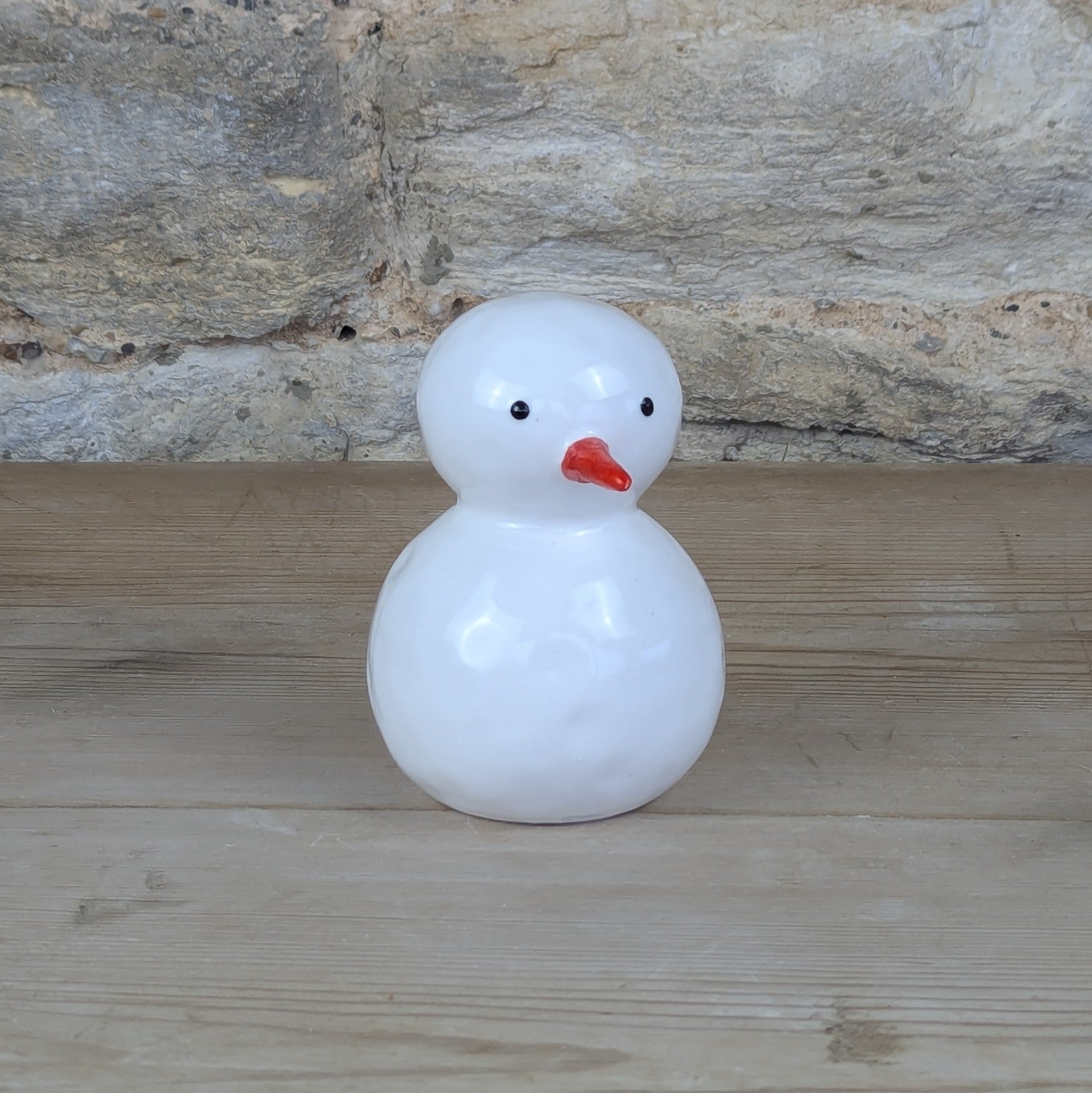 White Ceramic Snowman with Bright Orange Carrot Nose